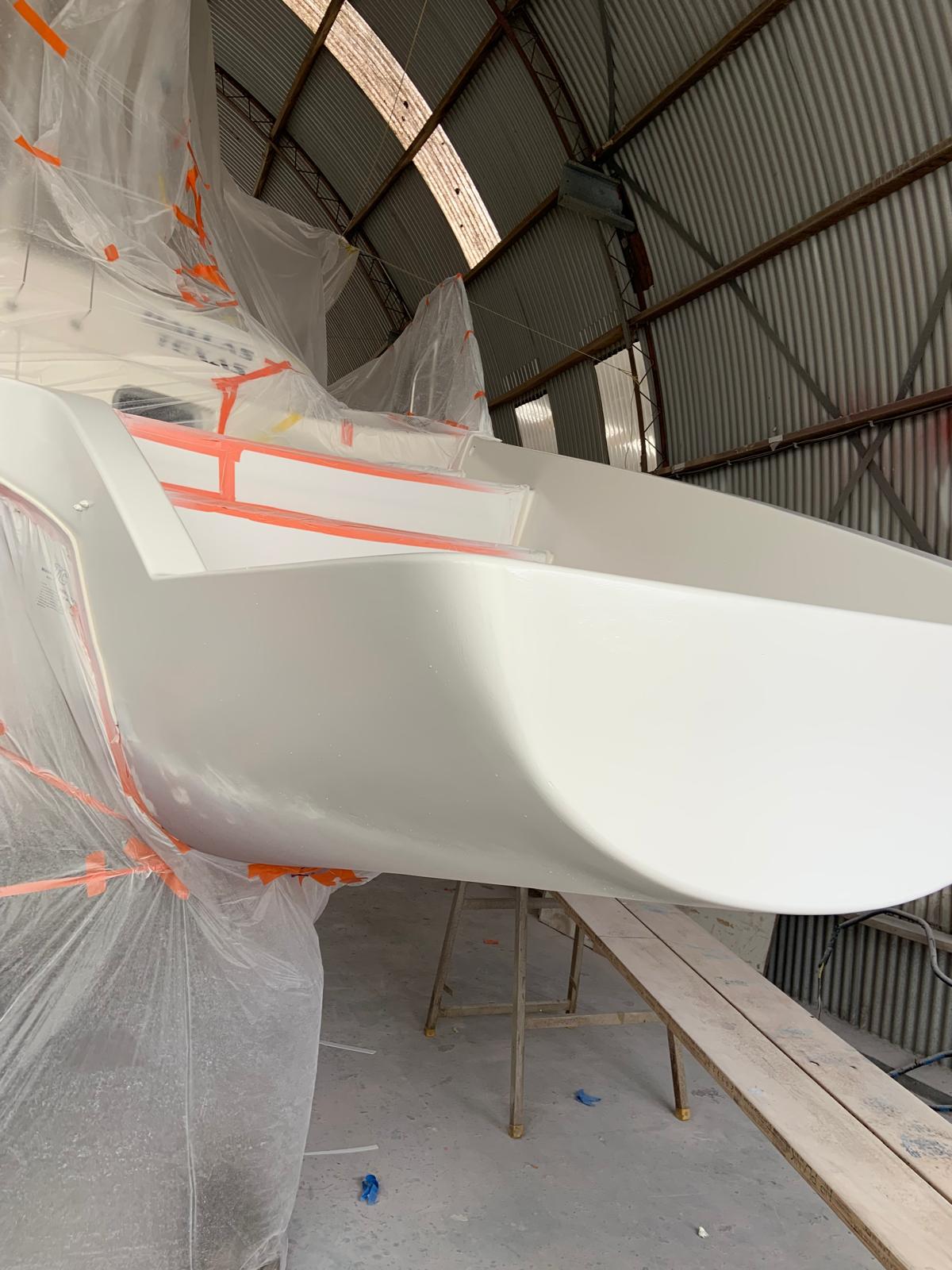 Catamaran hull freshly sprayed white